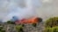 This image made from video shows fires burning on the slopes of Mt. Kilimanjaro in Tanzania, Oct. 23, 2022.