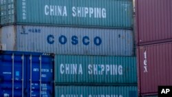 FILE -- Containers coming from China are piled in the harbor in Hamburg, Germany, Oct. 26, 2022.