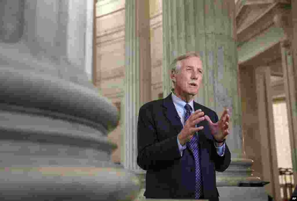 Senate Intelligence Committee member, Sen. Angus King, I-Maine, during a TV interview, defends the Senate Intelligence Committee's before the release of a report on the CIA's harsh interrogation techniques on Capitol Hill in Washington, Dec. 9, 2014.