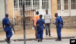 Police arrest a man following grenade attacks in the capital Bujumbura, Burundi Wednesday, Feb. 3, 2016.
