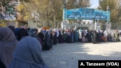 A long line of women wait to cast their ballots outside a Kabul polling station, Oct. 20, 2018.