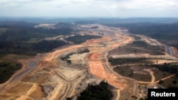 FILE - An aerial photograph shows the construction site of the Belo Monte hydroelectric dam at Pimental, near Altamira in Para State, Nov. 15, 2012. A test failure Wednesday in a transmission line connecting to the Belo Monte dam reportedly caused a power outage in Brazil. 