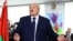 Belarusian President Alexander Lukashenko votes during the presidential election in Minsk
