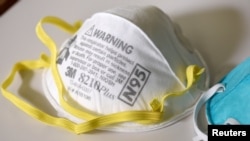 FILE - Michigan officials recently sent a cease-and-desist letter to a medical supply provider for selling N95 respirator masks, similar to those pictured, for $99.95 for a box of 10. The regular price was $15.