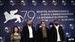 "The Kiev trial" filmmakers, (From L) Russian producer Maria Baker-Choustova, Ukrainian director Sergei Loznitsa, Russian director and producer Ilya Khrzhanovskiy and Polish film editor Tomasz Wolski pose on Sept. 4, 2022 in Venice, Italy. 