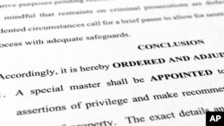 A page from the order granting a request by former President Donald Trump's legal team to appoint a special master to review documents seized by the FBI during a search of his Mar-a-Lago estate is photographed, Sept. 5, 2022. 