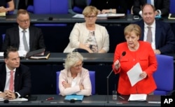 German Chancellor Angela Merkel delivers a statement on the G-7 summit prior to a government questioning as part of a meeting of the German parliament, Bundestag, at the Reichstag building in Berlin, Germany, June 6, 2018.