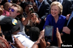 U.S. Democratic presidential nominee Hillary Clinton greets voters outside of an early voting site in Lauderhill, Florida, November 2, 2016.
