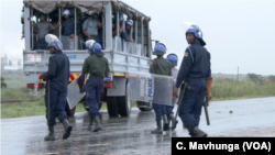 FILE - Police monitor the situation during three-day protests in Harare, Zimbabwe, January 2019. 