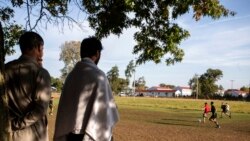 Members of the U.S. military and Afghan refugees play soccer at the Fort McCoy U.S. Army base, Sept. 30, 2021, in Fort McCoy, Wis. The fort is one of eight military installations across the country that are temporarily housing Afghans who fled their homeland after the U.S. troop withdrawal.