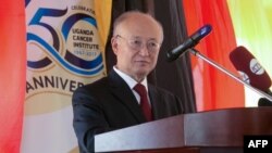 Children warm up themselves around a charcoal fire in Herat, Afghanistan.