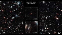 This image made available by the Space Telescope Science Institute Nov. 17, 2022, shows two of the galaxies captured by the James Webb Space Telescope in the outer regions of the giant galaxy cluster Abell 2744. (NASA; ESA; CSA; Tommaso Treu, UCLA; Zolt G. Levay, STScI, via AP)