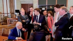 U.S. President Joe Biden, left, talks with world leaders about the missile strike on Poland at the G-20 Leaders' Summit, in Nusa Dua, Bali, Indonesia, Nov. 16, 2022. (Steffen Hebestreit/German government photo)