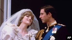 FILE - Britain's Prince Charles and his bride Diana, Princess of Wales, are shown on their wedding day on the balcony of Buckingham Palace in London, July 29, 1981.