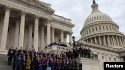Members-elect from the U.S. House of Representatives pose for a group photo outside of the U.S. Capitol building in Washington, Nov. 15, 2022.