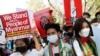 FILE - Myanmar citizens living in India attend a protest against the military coup in Myanmar and demanding recognition of the National Unity Government of Myanmar, in New Delhi, Feb. 22, 2022. 