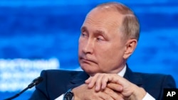 Russian President Vladimir Putin attends a plenary session at the Eastern Economic Forum in Vladivostok, Russia, Wednesday, Sept. 7, 2022. (Sergei Bobylev/TASS News Agency Host Pool Photo via AP)