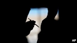 A man receives a COVID-19 vaccine at a vaccination site Feb. 17, 2021, in Las Vegas. 