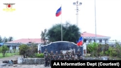 Members of the Arakan Army pose outside Thandwe Airport after they captured the airport in Thandwe, western state of Rakhine, Myanmar, July 5, 2024. 