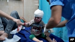 Palestinian child wounded in Israeli bombardment is treated in a hospital in Deir al Balah, south of the Gaza Strip, Nov. 3, 2023.