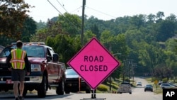 The road is blocked, July 14, 2024, to the Bethel Park, Pennsylvania, home believed to be connected to the shooter in the assassination attempt of Republican presidential candidate former President Donald Trump. 