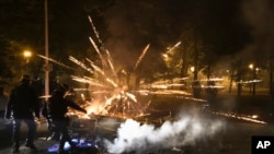 Police clear a street on the third night of protests sparked by the fatal police shooting of a 17-year-old driver in the Paris suburb of Nanterre, France, June 30, 2023.