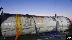 This photo provided by South Korea's Defense Ministry shows an object salvaged by South Korea's military that is presumed to be part of the North Korean space-launch vehicle that crashed into sea following a launch failure, in West Sea, South Korea, June 15, 2023.