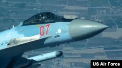 A Russian fighter flies dangerously close to a US MQ-9 drone before deploying flares directly over the drone that was on a mission in Syria July 23, 2023. (US Air Force photo)