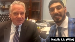 FILE- Enes Kanter Freedom (right) shared a moment with U.S. Representative Chris Smith, chairman of the Congressional Executive Commission on China, on July 11, 2023 in Washington.