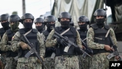 FILE - Military members guard the outside of Guayas 1 prison in Guayaquil, Ecuador, on April 14, 2023.