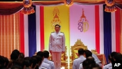 Thailand's King Maha Vajiralongkorn stands with lawmakers during parliament's opening, in Bangkok, Thailand, July 3, 2023. (Sunti Teapia/Manage newspaper pool via AP) 