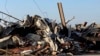 Debris covers a damaged structure in Rolling Fork, Mississippi, March 25, 2023. Powerful tornadoes tore through the Deep South on Friday night, killing several people in Mississippi, obliterating dozens of buildings. 