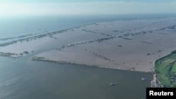 Aerial shots of dike breach and flooding, Tuanzhou Town, Yueyang City, Hunan Province, central China, July 6, 2024.