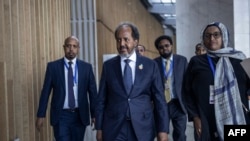 President of Somalia Hassan Sheikh Mohamud, center, makes his way to conduct a press conference following the 37th Ordinary Session of the Assembly of the African Union at the AU headquarters in Addis Ababa, Feb. 17, 2024.