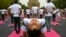 People take part in a yoga session at Lodhi gardens on International Day of Yoga, in New Delhi.