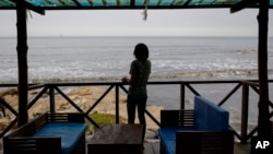 FILE - Efua, a 25-year-old fashion designer and single mother in Ghana who became pregnant in 2023, poses for a photo in Accra, Ghana, March 19, 2024.