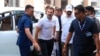 India's opposition Congress Party leader Rahul Gandhi, second-left, arrives at a court in Surat, India, March 23, 2023.