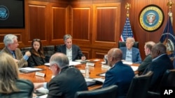 In this image provided by the White House, President Joe Biden, along with members of his national security team, receive an update on an ongoing airborne attack on Israel from Iran, as they meet in the Situation Room of the White House, Apr. 13, 2024. 