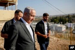 Israeli Prime Minister Benjamin Netanyahu arrives for a briefing near the Salem military post between Israel and the West Bank, July 4, 2023.