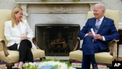President Joe Biden meets with Italian Prime Minister Giorgia Meloni in the Oval Office of the White House, July 27, 2023, in Washington.