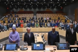 U.N. Secretary-General Antonio Guterres, 2nd left, and members of the U.N. agency observe a minute of silence in memory of colleagues killed in Gaza during the Israel-Hamas conflict, at U.N. headquarters in New York, Nov. 13, 2023.
