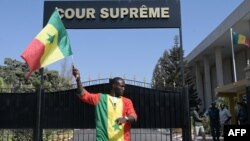 La Cour constitutionnelle a annulé le décret du président Sall qui, de facto, modifiait le calendrier électoral, trois semaines seulement avant l'échéance. (Photo by Seyllou / AFP)
