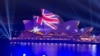 Gedung Opera dihiasi dengan bendera Australia di Sydney, 26 Januari 2023. Australia tengah memperkuat kemampuan pertahanan rudalnya di tengah "kekhawatiran serius" terkait uji coba rudal balistik antarbenua. (Foto: AFP)