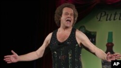 FILE - In this June 2, 2006, file photo, Richard Simmons speaks to the audience before the start of a summer salad fashion show at Grand Central Terminal in New York. 