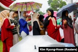 Antrean di TPS saat pemilihan umum di Bogor, Jawa Barat, 14 Februari 2024. (Foto: REUTERS/Kim Kyung-Hoon)