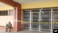 A Filipino trooper guards the entrance of the site where a bomb exploded in Marawi, southern Philippines, Dec. 3, 2023. 