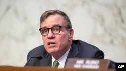 FILE - Chairman Mark Warner speaks during a Senate Intelligence Committee hearing at the Capitol in Washington, March 8, 2023.