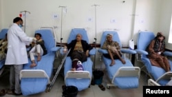 FILE - A doctor attends to cancer patients at a cancer treatment center in Sana'a, Yemen, Feb. 11, 2017. 