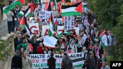 Protesters wave Palestinian flags as they take part in a demonstration to demand a cease-fire in Gaza in Montpellier, France, on Nov. 18, 2023.