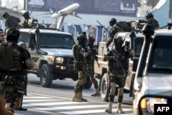 Afghan security personnel arrive at the Kabul airport as they prepare to welcome two former prisoners held at the U.S. detention center in Guantanamo Bay, in Kabul, Feb. 12, 2024.